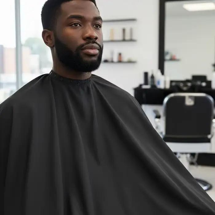 Cape de coiffure professionnelle avec fermeture à pression réglable