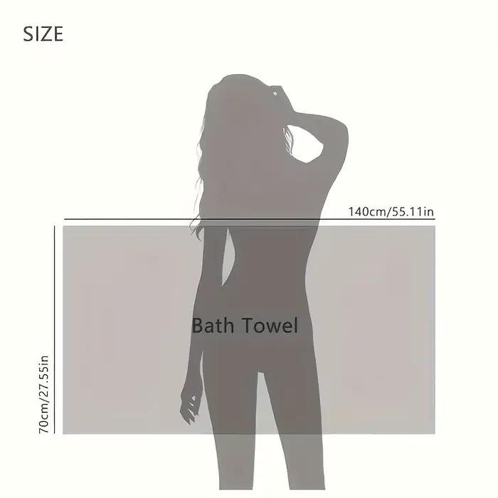 Une serviette de bain en tissu gaufré en microfibre ultra-absorbante
