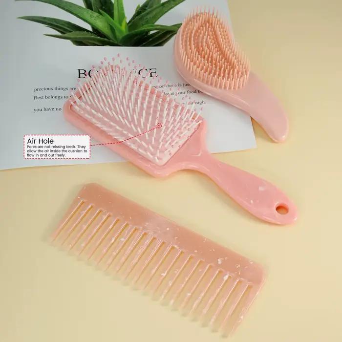 Brosse à cheveux rose et peigne démêlant
