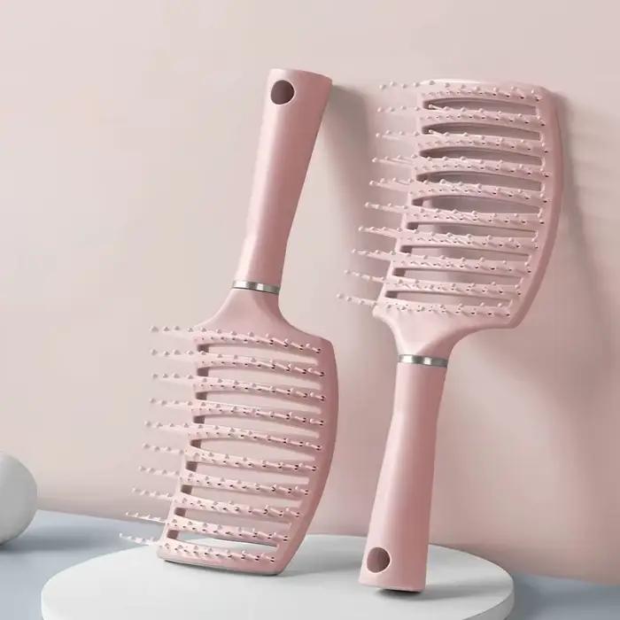 Brosse à cheveux avec coussin d'air
