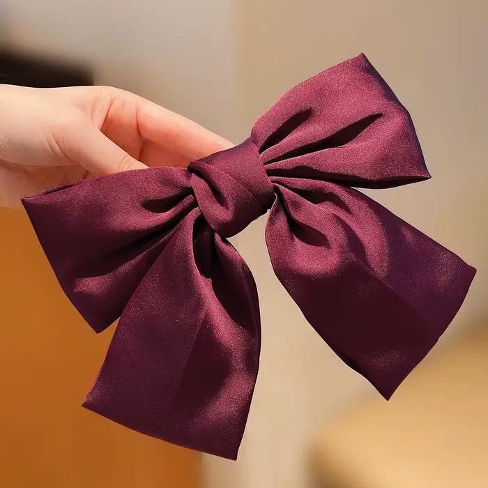 Pince à cheveux avec gros nœud rouge, petite fille, vent doux, 1