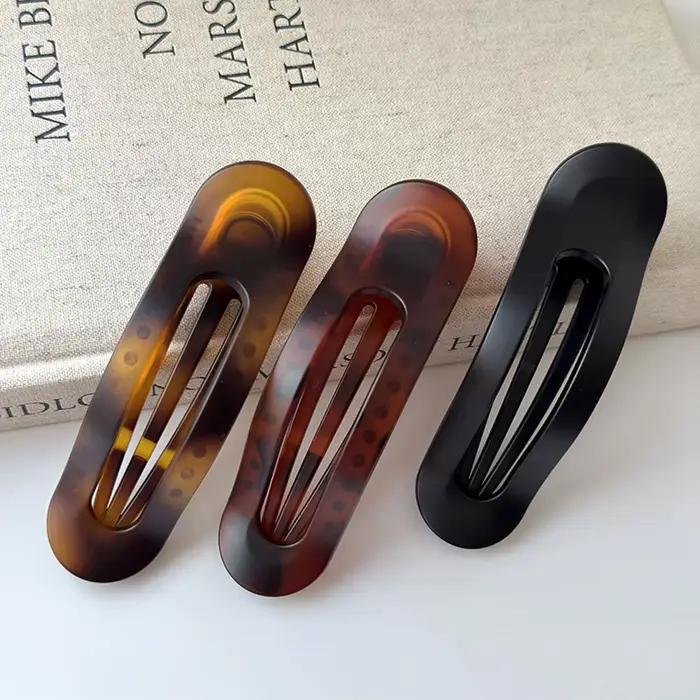 Pince à cheveux ovale tendance pour femme