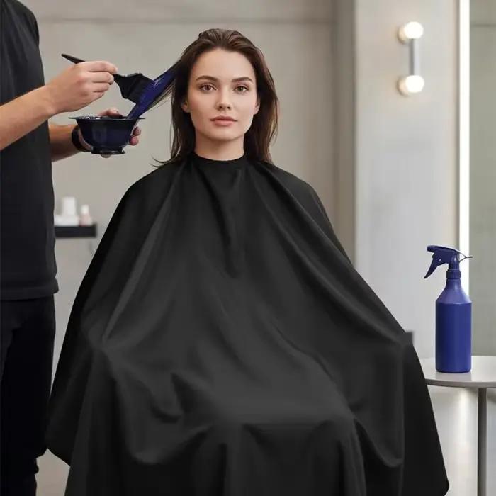 Cape de coiffure professionnelle avec fermeture à pression réglable